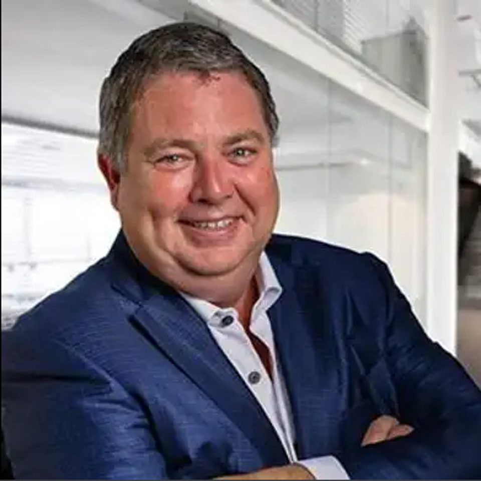 Adam Young, CEO and Founder of Event Tickets Center posing for a professional photo.