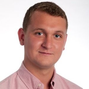 Anthony Amato, a VP at Event Tickets Center, posing for a professional photo